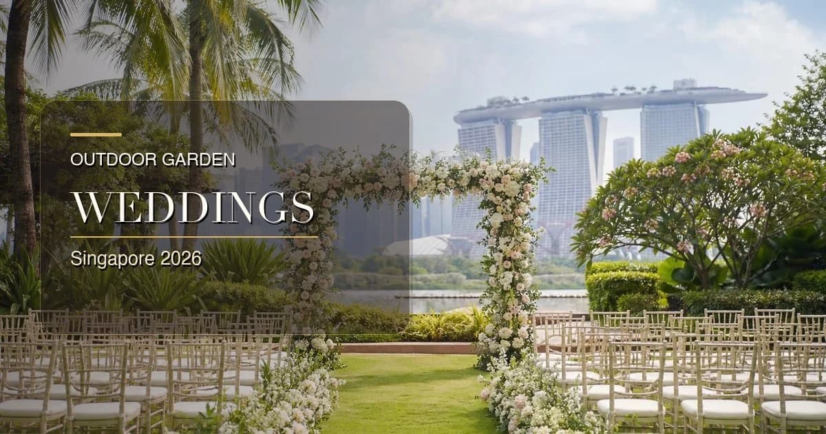 Couple at an outdoor garden wedding venue in Singapore with greenery, floral arch and skyline views